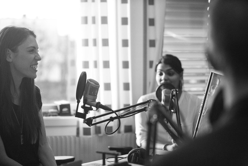 Women talking during a podcast