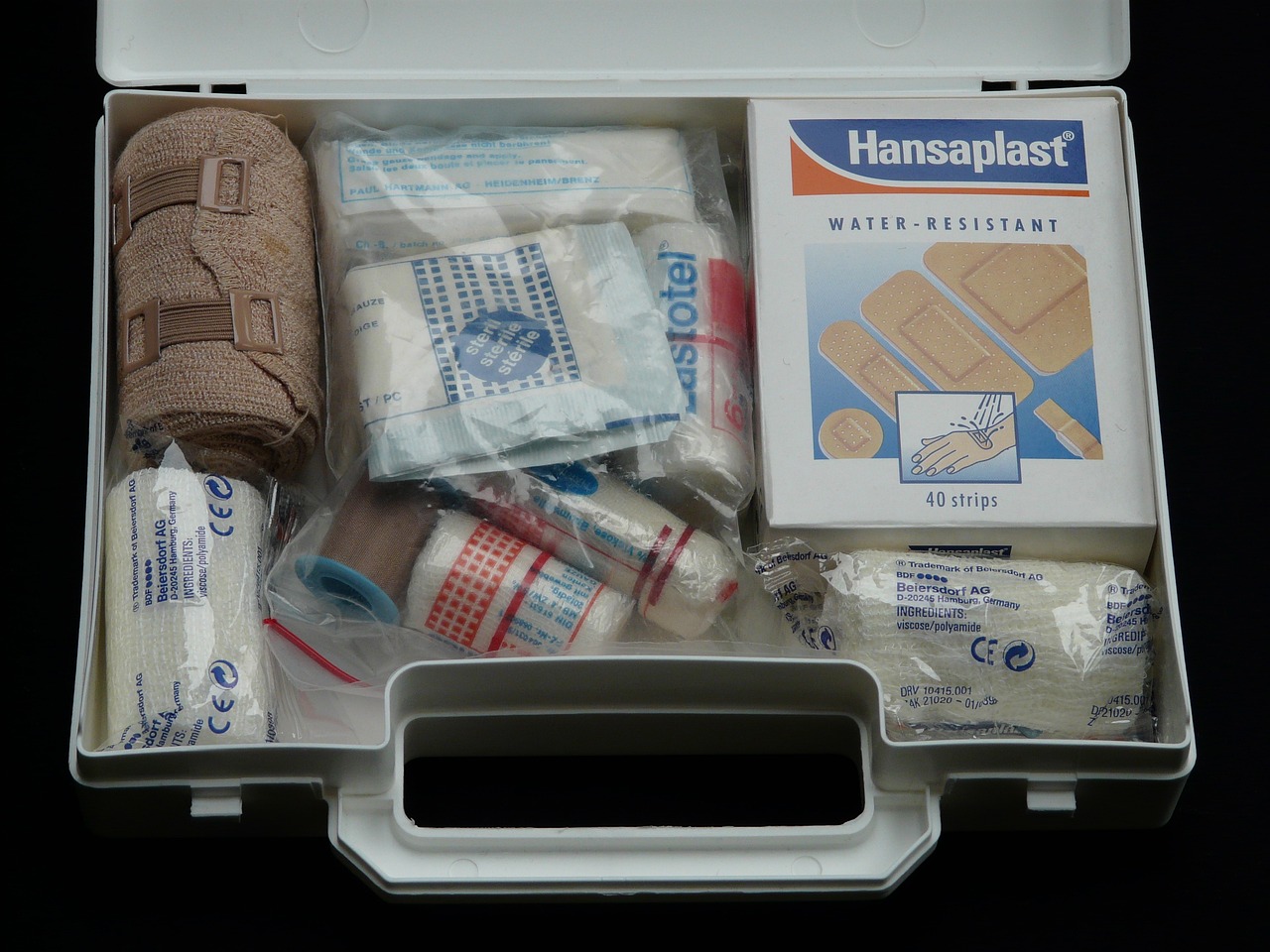 First aid kit for a coach's equipment bag that includes wraps and band aids.