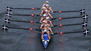 Female rowing team in the boat on the water